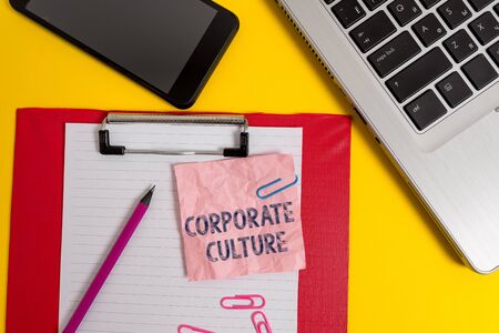 Word writing text Corporate Culture. Business photo showcasing pervasive values and attitudes that characterize a company Laptop clipboard sheet clips pencil note smartphone colored backgroundの写真素材