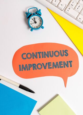 Writing note showing Continuous Improvement. Business concept for ongoing effort to improve products or processesの写真素材