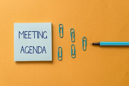 Word writing text Meeting Agenda. Business photo showcasing items that participants hope to accomplish at a meeting Colored blank sticky note clips binders gathered pen trendy cool backgroundの写真素材