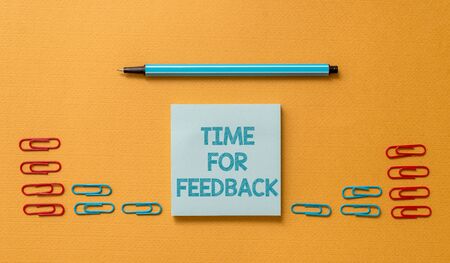 Handwriting text Time For Feedback. Conceptual photo information about reactions to a product or services Colored blank sticky note clips binders gathered pen trendy cool backgroundの写真素材