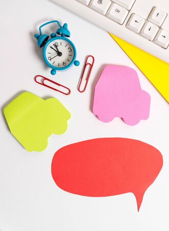 Flat lay above table with copy space on the bubble paper with clock and paper clips.の写真素材