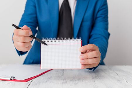 Man holds empty paper with copy space in front of him. White space for advertising message.の写真素材