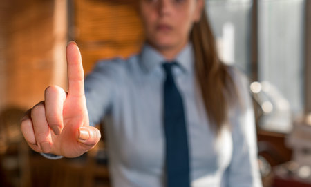 Blurred woman in the background pointing with finger in empty space.