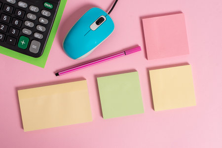 Blank notepads wire mouse calculator sheet marker pen colored background