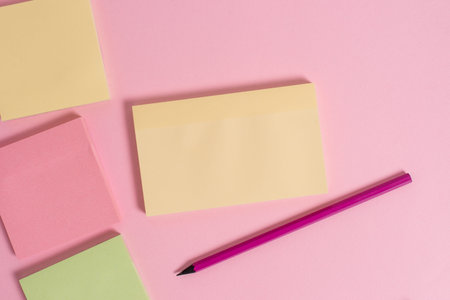 Close up view four multicolor blank notepads marker colored background