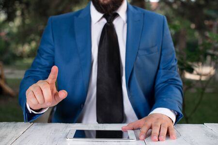 Businessman with pointing finger in front of him.の写真素材