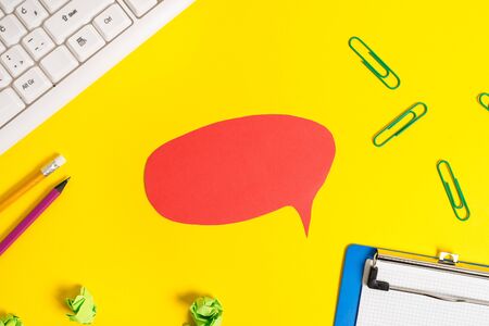 Flat lay above empty paper with copy space and colored paper clips.の写真素材