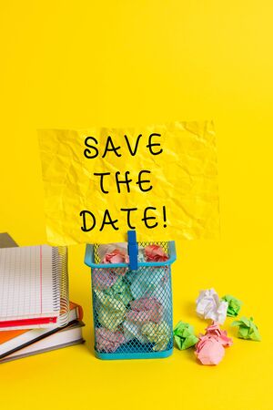 Conceptual hand writing showing Save The Date. Concept meaning Organizing events well make day special event organizers Trash bin crumpled paper clothespin office supplies yellowの写真素材