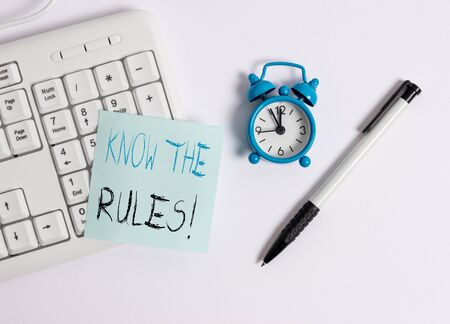 Text sign showing Know The Rules. Business photo text set explicit or regulation principles governing conduct White pc keyboard with empty note paper above white backgroundの写真素材