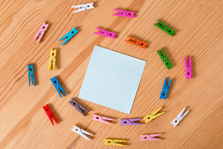 Colored clothespin papers empty reminder wooden floor background office