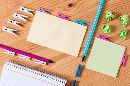 Colored clothespin papers empty reminder wooden floor background officeの写真素材