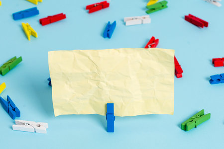 Colored clothespin papers empty reminder blue floor background office pin