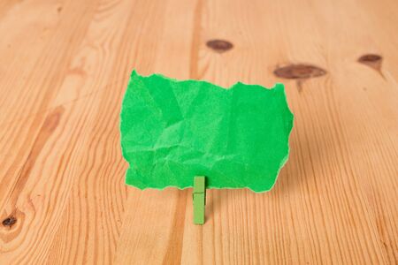 Empty reminder wooden floor background green clothespin groove slot officeの写真素材