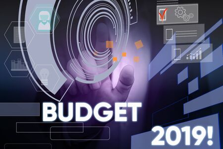 Conceptual hand writing showing Budget 2019. Concept meaning estimate of income and expenditure for current year Male wear formal suit presenting presentation smart deviceの写真素材