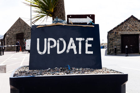 Text sign showing UPDATE. Business photo showcasing make something more modern or up to date like...