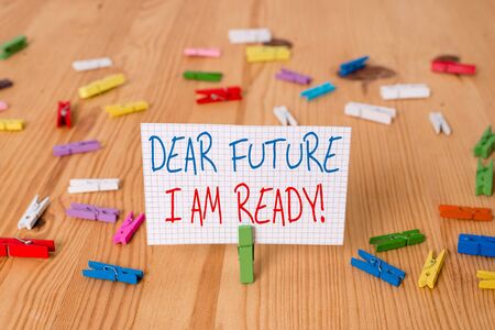 Text sign showing Dear Future I Am Ready. Business photo text suitable state for action or situation being fully prepared Colored clothespin papers empty reminder wooden floor background officeの写真素材