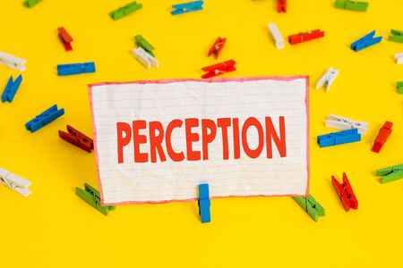 Conceptual hand writing showing Perception. Concept meaning individuals organize and interpret their sensory impressions Colored clothespin papers empty reminder yellow floor officeの写真素材