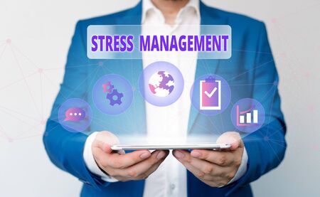 Word writing text Stress Management. Business photo showcasing method of limiting stress and its effects by learning ways Male human wear formal work suit presenting presentation using smart deviceの写真素材