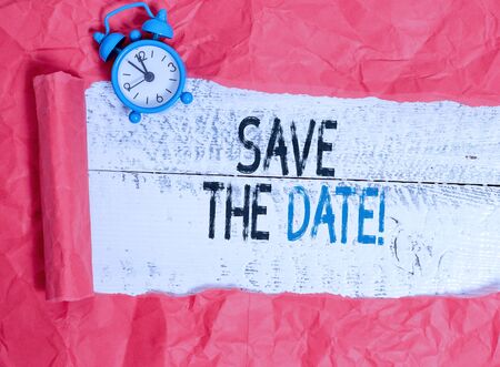 Writing note showing Save The Date. Business concept for reserve the mentioned future wedding date on their calendarの写真素材