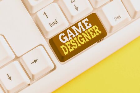 Word writing text Game Designer. Business photo showcasing Campaigner Pixel Scripting Programmers Consoles 3D Graphics White pc keyboard with empty note paper above white background key copy spaceの写真素材