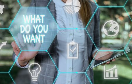 Handwriting text writing What Do You Want. Conceptual photo used for offering something to someone or asking their need Female human wear formal work suit presenting presentation use smart deviceの写真素材