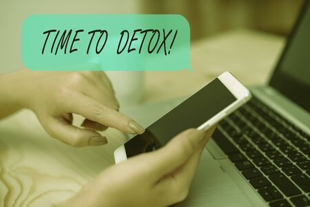 Conceptual hand writing showing Time To Detox. Concept meaning when you purify your body of toxins or stop consuming drug woman with laptop smartphone and office supplies technologyの写真素材