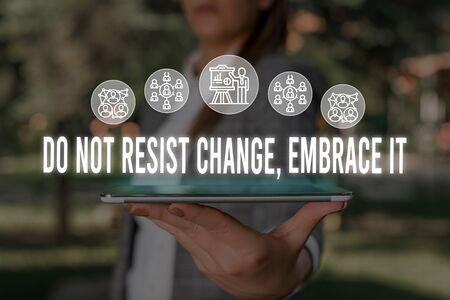 Handwriting text Do Not Resist Change Embrace It. Conceptual photo Be open to changes try new things Positive Woman wear formal work suit presenting presentation using smart deviceの写真素材