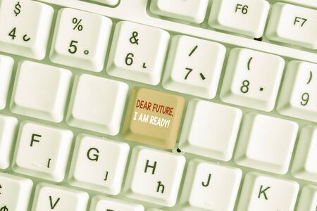 Writing note showing Dear Future I Am Ready. Business concept for Confident to move ahead or to face the future White pc keyboard with note paper above the white backgroundの写真素材