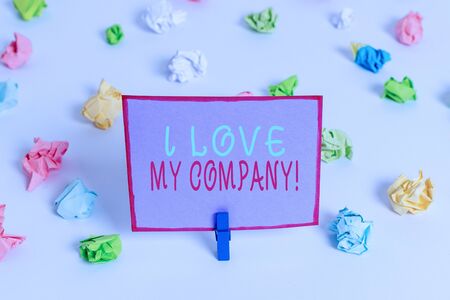 Writing note showing I Love My Company. Business concept for tell why admire their job and workplace Colored crumpled paper empty reminder white floor clothespinの写真素材