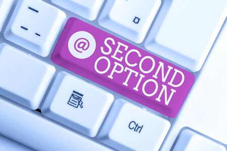 Writing note showing Second Option. Business concept for Next Fiddle Not a priority Next Alternative Opportunity White pc keyboard with note paper above the white backgroundの写真素材