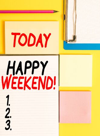 Conceptual hand writing showing Happy Weekend. Concept meaning something nice has happened or they feel satisfied with life Empty papers with copy space on yellow background tableの写真素材