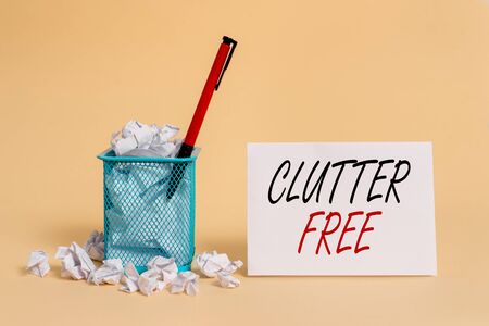 Text sign showing Clutter Free. Business photo showcasing Well organized and arranged Tidy All things in right places crumpled paper trash and stationary with note paper placed in the trash canの写真素材