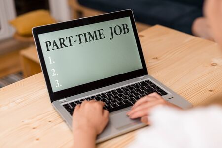Word writing text Part Time Job. Business photo showcasing Weekender Freelance Casual OJT Neophyte Stint Seasonal woman laptop computer smartphone mug office supplies technological devicesの写真素材