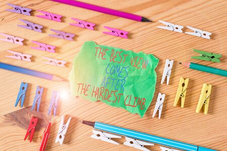 Writing note showing The Best View Comes After The Hardest Climb. Business concept for reaching dreams takes effort Colored clothespin papers empty reminder wooden floor background officeの写真素材