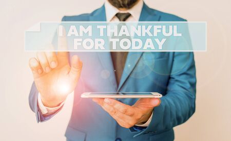 Handwriting text I Am Thankful For Today. Conceptual photo Grateful about living one more day Philosophy Businessman with pointing finger in front of himの写真素材