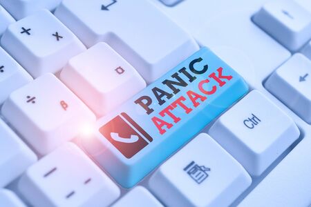 Text sign showing Panic Attack. Business photo text sudden periods of intense fear that may include palpitations White pc keyboard with empty note paper above white background key copy spaceの写真素材