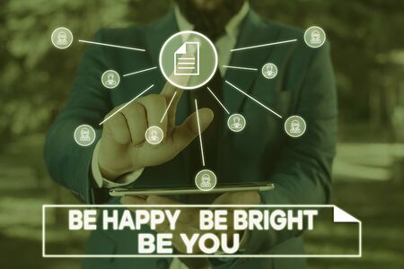 Handwriting text writing Be Happy Be Bright Be You. Conceptual photo Selfconfidence good attitude enjoy cheerful Male human wear formal work suit presenting presentation using smart deviceの写真素材