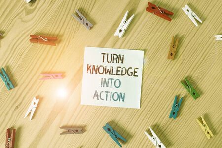 Writing note showing Turn Knowledge Into Action. Business concept for Apply what you have learned...