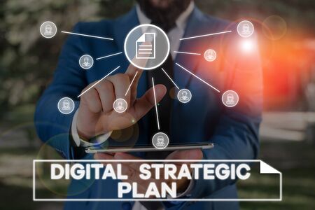 Handwriting text writing Digital Strategic Plan. Conceptual photo creat schedule for marketing product or brand Male human wear formal work suit presenting presentation using smart deviceの写真素材