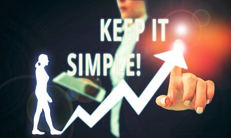 Text sign showing Keep It Simple. Business photo text ask something easy understand not go into too much detail Female human wear formal work suit presenting presentation use smart deviceの写真素材