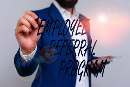 Text sign showing Employee Referral Program. Business photo showcasing employees are rewarded for introducing recruits Businessman in blue suite and white shirt pointing with finger in empty spaceの写真素材
