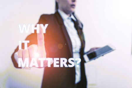 Conceptual hand writing showing Why It Matters question. Concept meaning ask demonstrating about something he think is important Digital business in black suite concept with business womanの写真素材