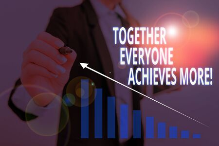 Text sign showing Together Everyone Achieves More. Business photo text Members create synergy with strong sense mutual commitment Woman wear formal work suit presenting presentation using smart deviceの写真素材