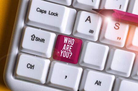 Word writing text Who Are You question. Business photo showcasing asking about demonstrating identity or demonstratingal information White pc keyboard with empty note paper above white background key copy spaceの写真素材