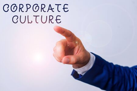 Word writing text Corporate Culture. Business photo showcasing pervasive values and attitudes that characterize a company Isolated hand pointing with finger. Business concept pointing fingerの写真素材