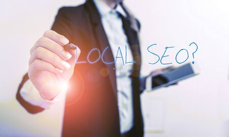 Writing note showing Local Seoquestion. Business concept for incredibly effective way to market your local business online Digital business in black suite concept with business womanの写真素材