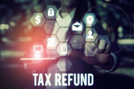 Writing note showing Tax Refund. Business concept for refund on tax when the tax liability is less than the tax paidの写真素材