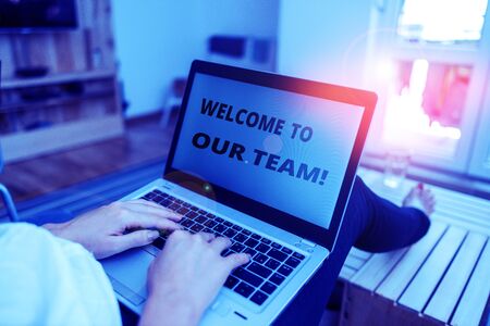 Word writing text Welcome To Our Team. Business photo showcasing introducing another demonstrating to your team mates woman laptop computer office supplies technological devices inside homeの写真素材
