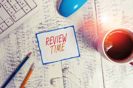 Writing note showing Review Time. Business concept for to think or talk about something again Set...