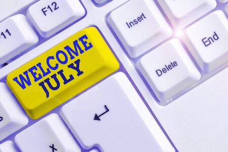Handwriting text Welcome July. Conceptual photo Calendar Seventh Month 31days Third Quarter New Season White pc keyboard with empty note paper above white background key copy spaceの写真素材